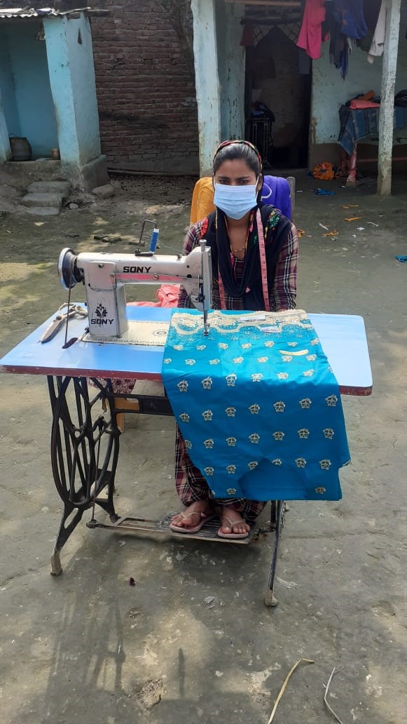Hasana is being started earning money by sewing neighbour clothes